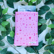 Load image into Gallery viewer, Laid Flat is a small-sized Sending My Love book sleeve, with a book coming out of the top of the sleeve.