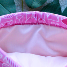 Load image into Gallery viewer, Sending My Love is being held open, and you can see a soft pink inlay fabric inside of the sleeve.