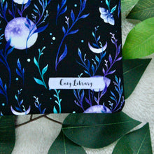 Load image into Gallery viewer, A detailed close up of Lunar Magic. Also seen is the Cozy Library tag sewn into the sleeve.