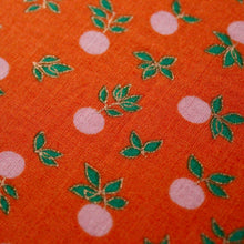 Load image into Gallery viewer, An angled close up picture of the Nothing Rhymes with Orange design, showing the gold detailing throughout the design.