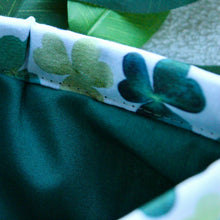 Load image into Gallery viewer, A detailed close up of Shamrock Fields, showing the dark green inlay, matching the darker tones of the outer fabric.