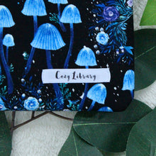 Load image into Gallery viewer, A close up of Wild Witch, showing small details of the design. Also seen in the Cozy Library tag, sewn in.