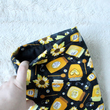 Load image into Gallery viewer, Honey Jars is being held open, there's a black fabric inlay inside.