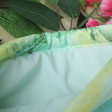Load image into Gallery viewer, Sea Foam is being held open. Inside we see a light green inlay.