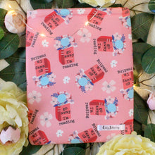 Load image into Gallery viewer, A book pink book sleeve with open an open book that has flowers coming out of it. The book reads "Go away, I'm reading" in black text. The background of the fabric is a light pink.
