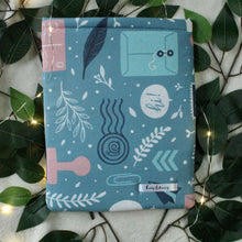 Load image into Gallery viewer, Mail accessories are shown in light blue, dark blue, and light pink. the fabric has a grey-blue background.