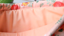 Load image into Gallery viewer, Just Peachy is being held open. Inside we see the matching peach coloured inlay.
