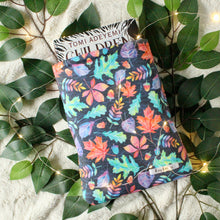 Load image into Gallery viewer, Hardcover book of Children of Blood and Bone by Tomi Adeyemi in a Medium sized Autumn Leaves book sleeves. Picture is titled to the left.