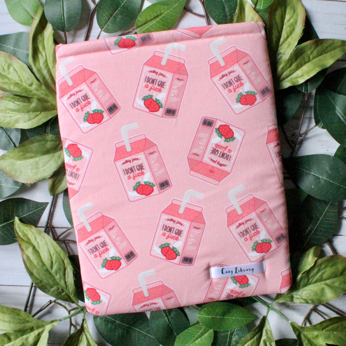 A soft pink book sleeve with child sized milk cartons that read 